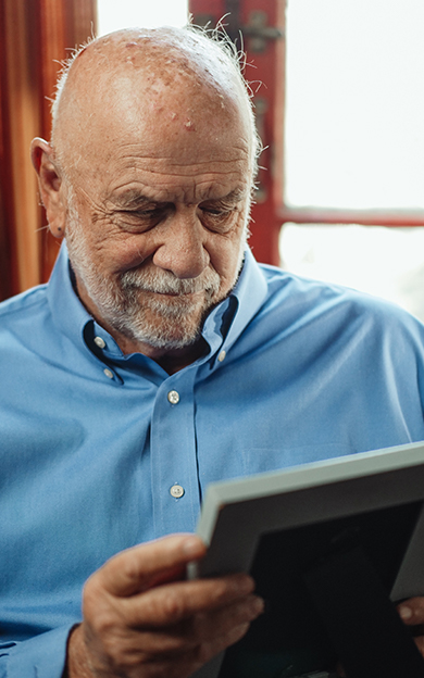resident looking at picture of loved one