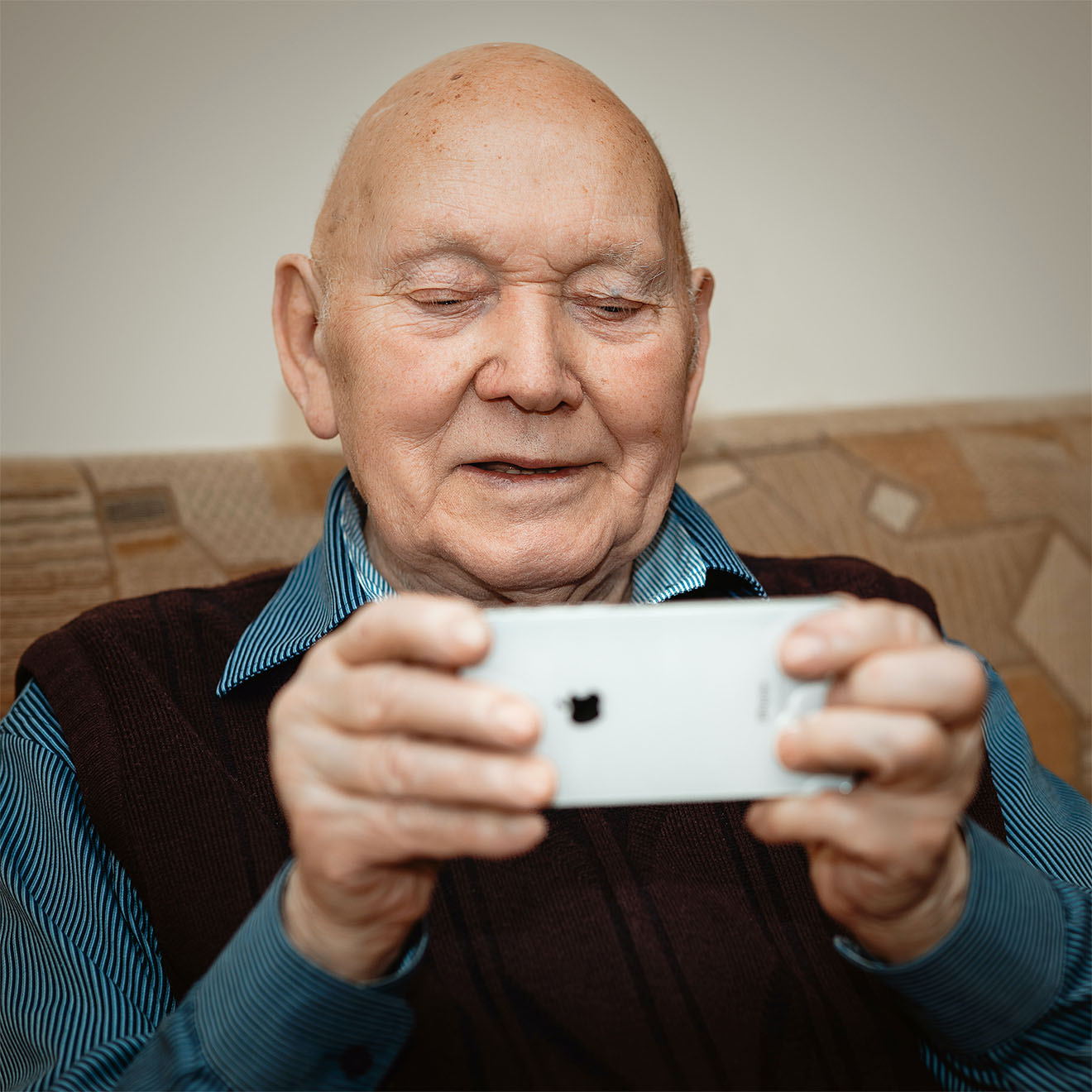 resident playing on a phone