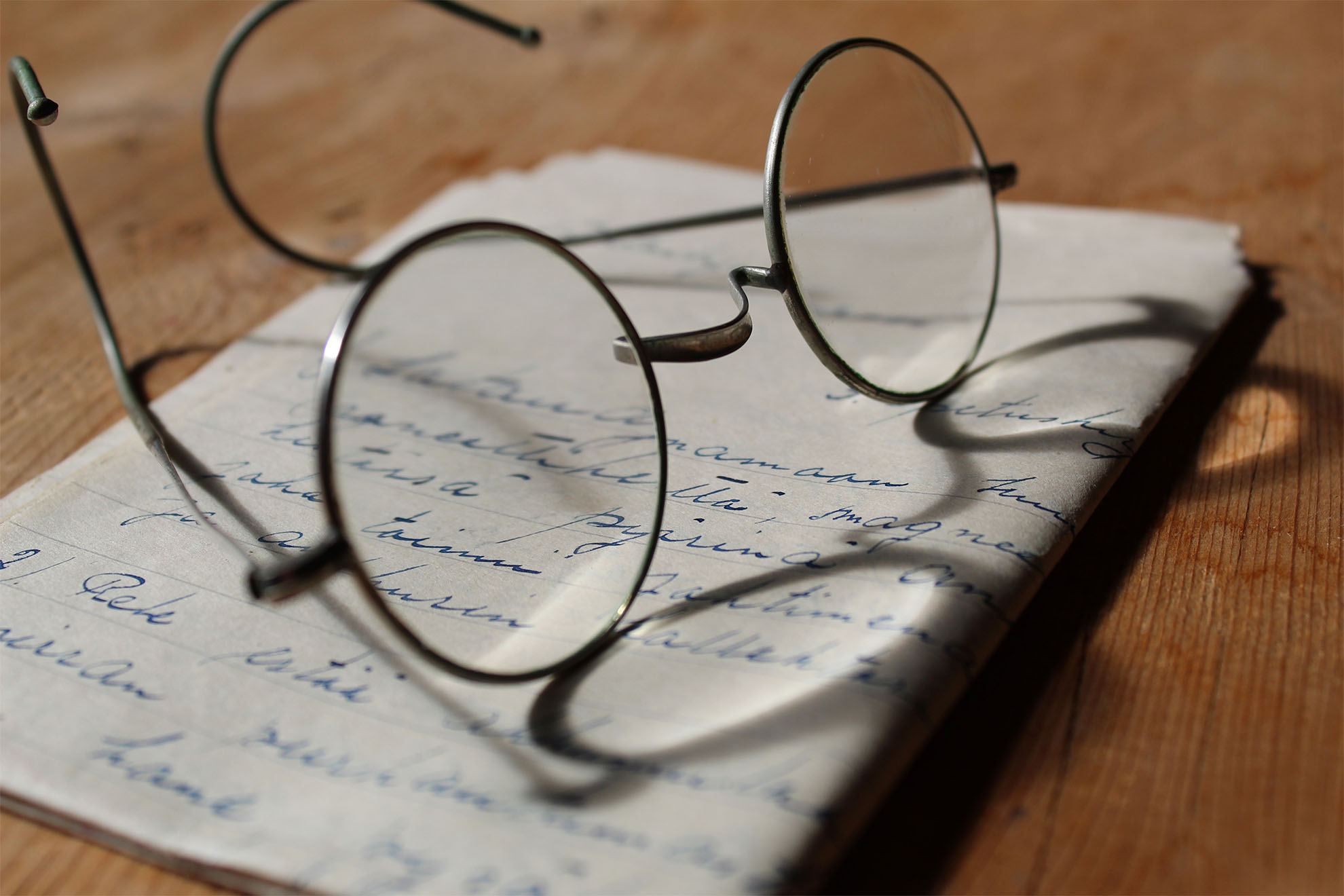 glasses on a written letter