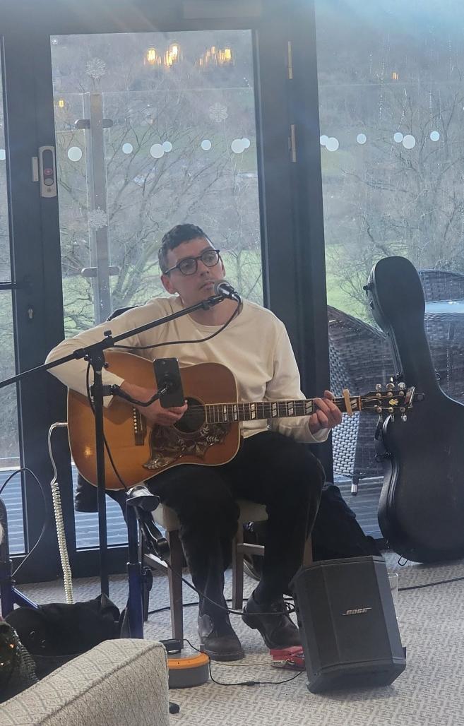 man playing a guitar