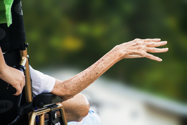 older woman with her hand out to the side