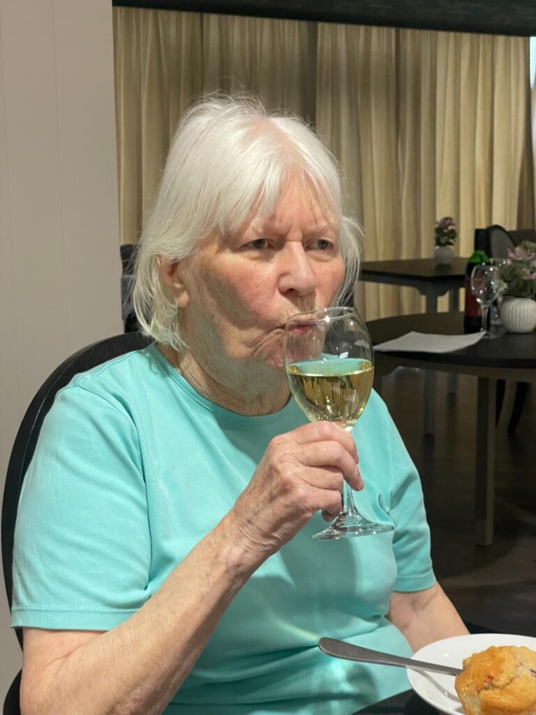 resident enjoying a glass of wine