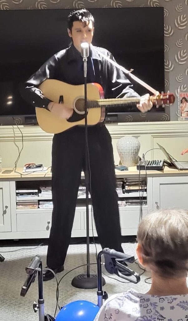 elvis presley personator performing