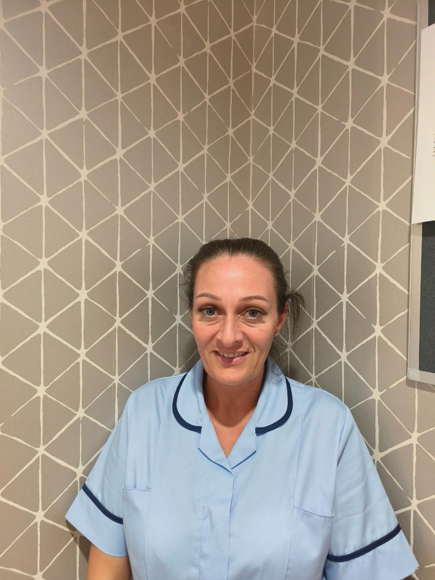 lady smiling for staff photo