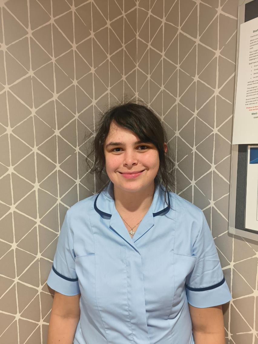 lady smiling for staff photo