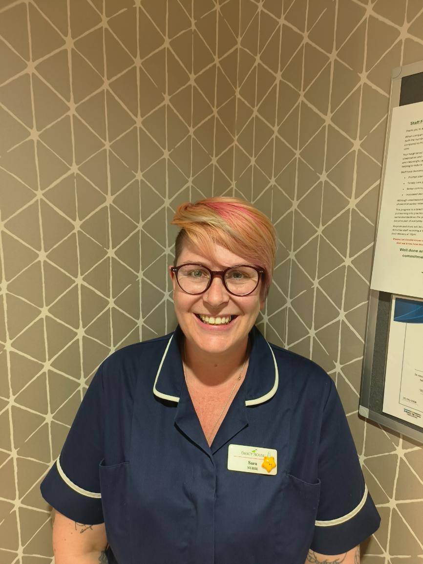 lady smiling for staff photo