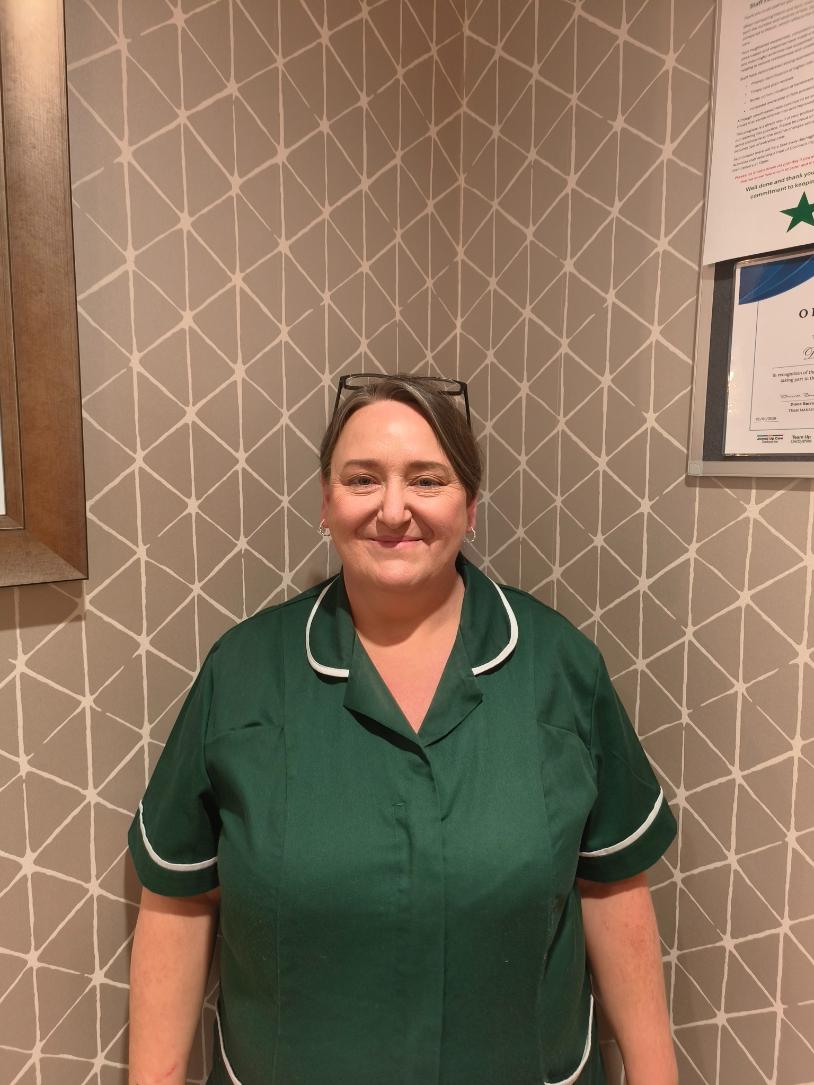 lady smiling for staff photo