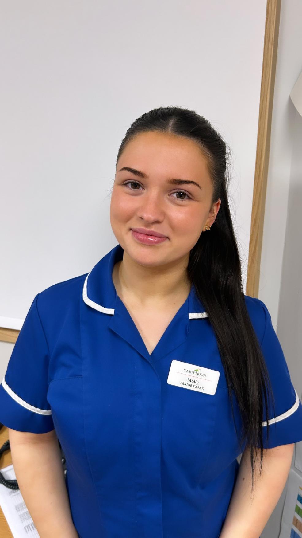 lady smiling for staff photo