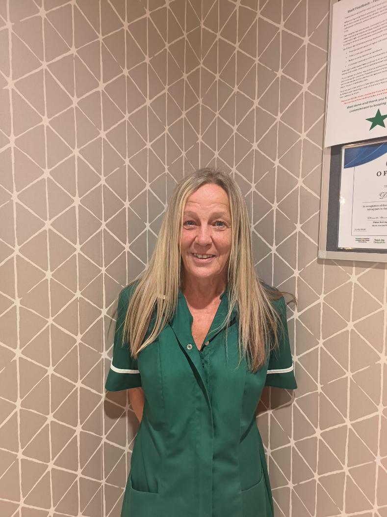 lady smiling for staff photo