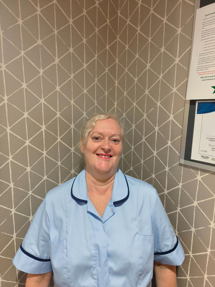 lady smiling for staff photo