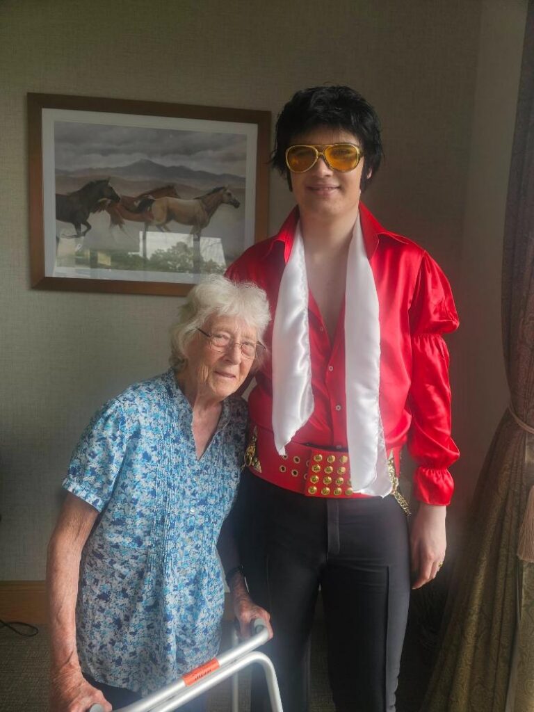 older lady with an elvis impersonator