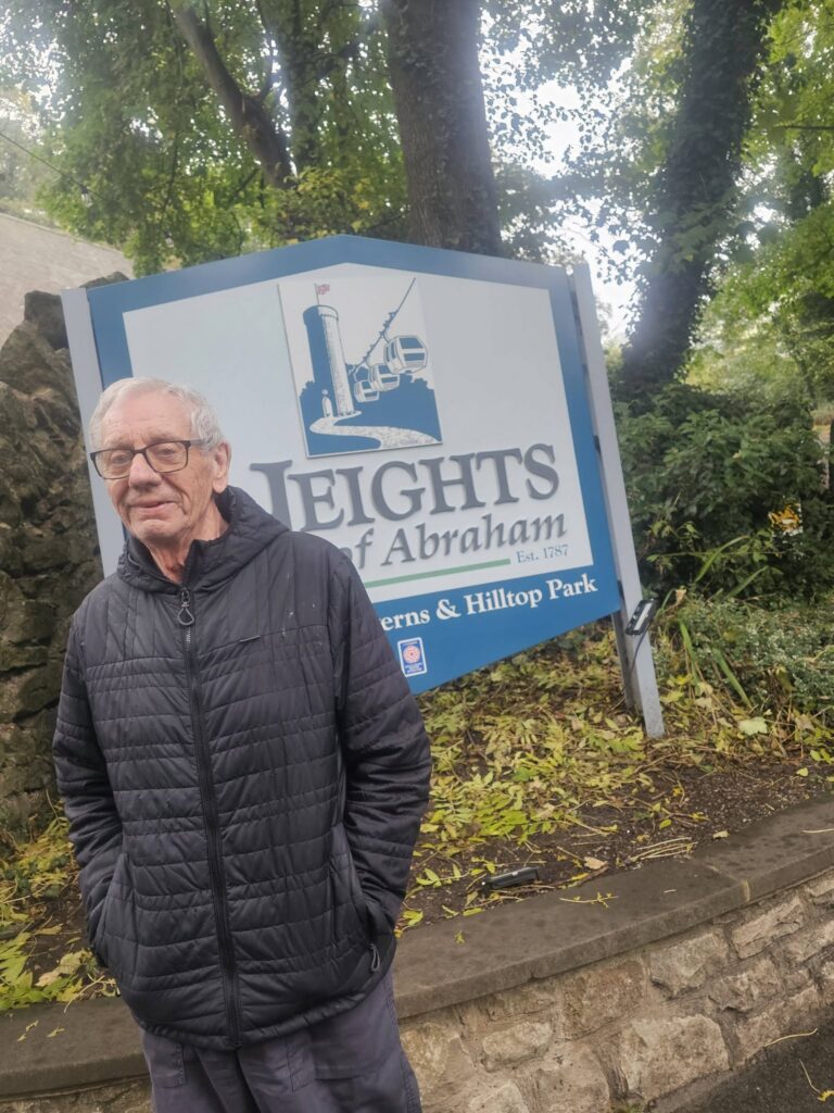 resident standing with sign
